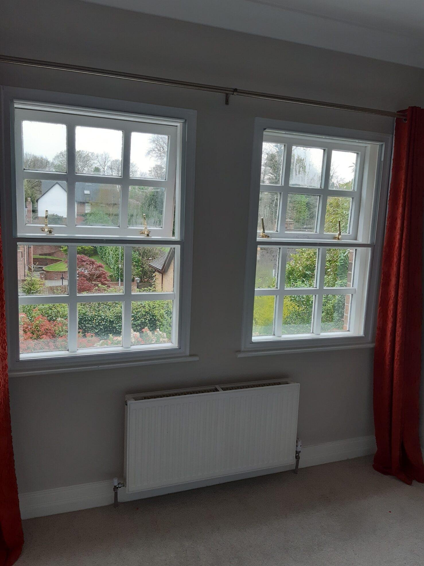 The aluminium transoms hide behind the transoms of the primary window, making them blend in perfectly